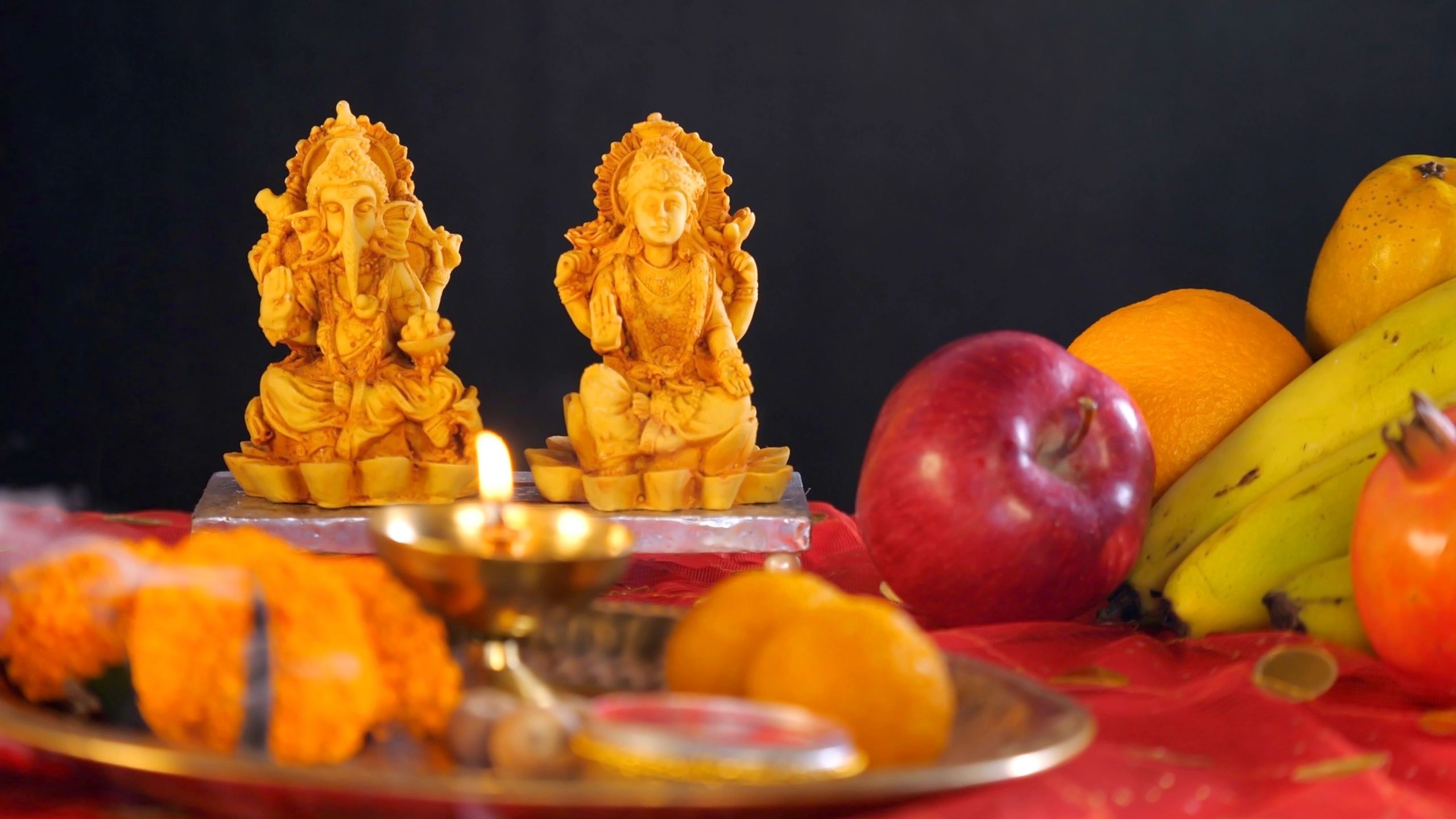 Pooja thali with diya and flowers prepared for worship